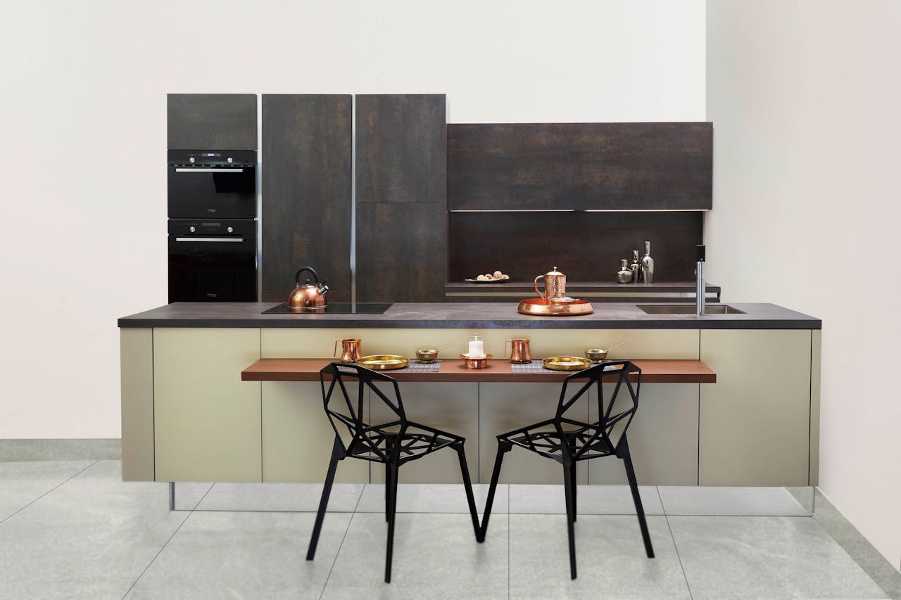 services-03 Elegant modern kitchen featuring copper accents and minimalist design.